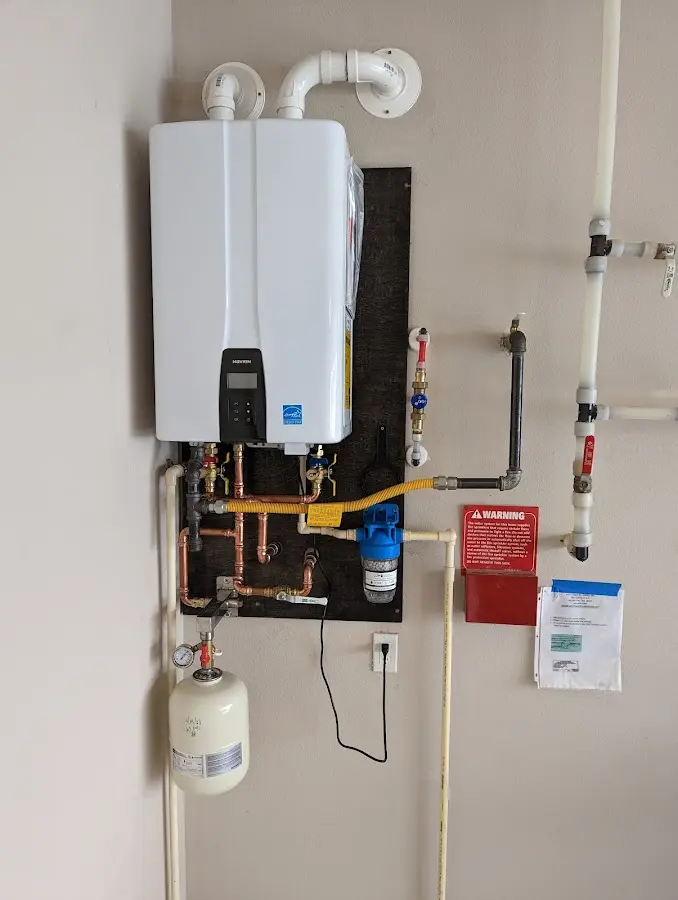 Professional plumber installing copper piping in a Alondra Park home